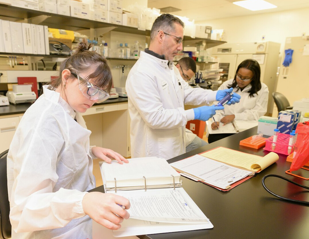 scientists analyzing artifacts