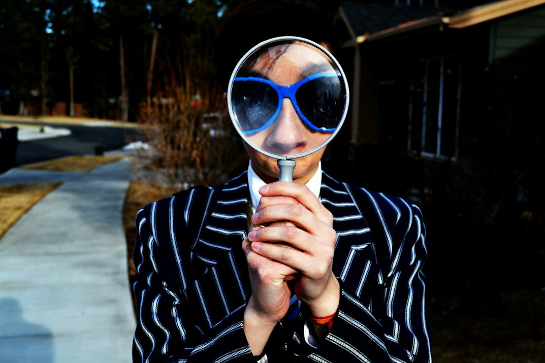 investigator with magnifying glass